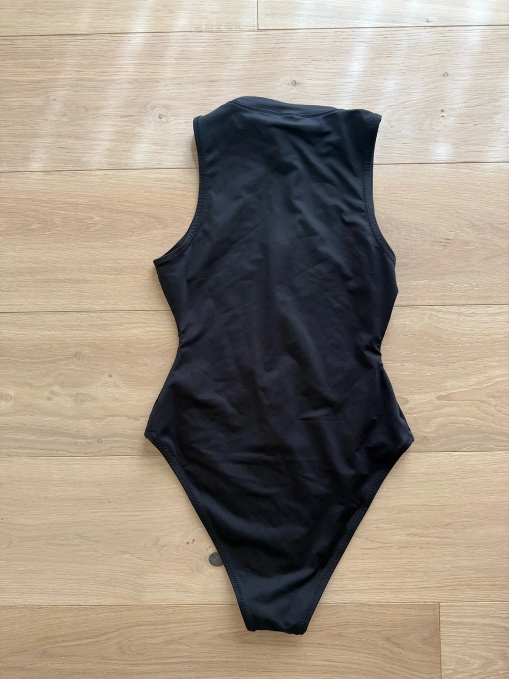 The Skims Black Zip-Front Swimsuit in Size Small